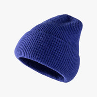 Blue knit beanie on a white background