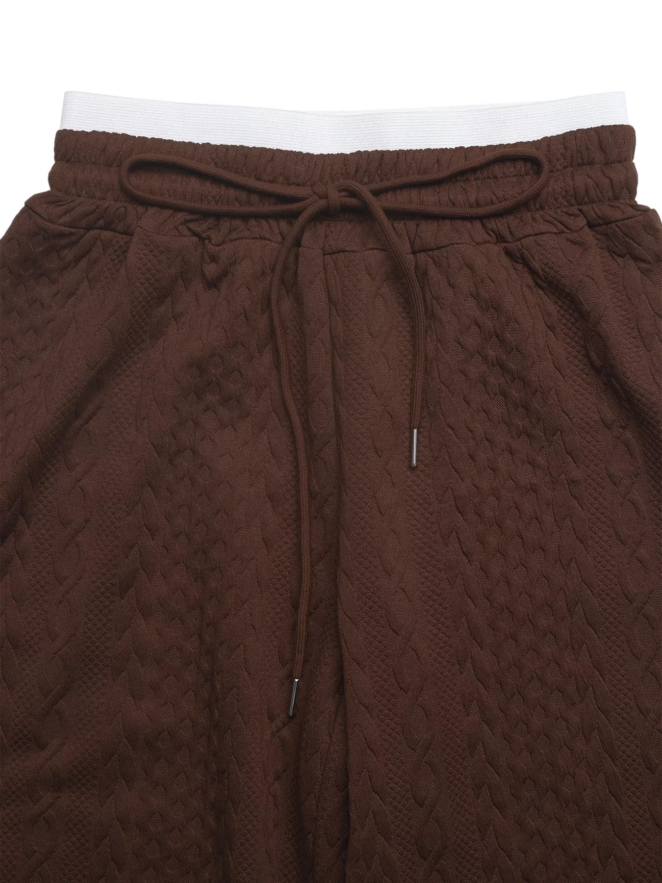 Brown textured pants with a drawstring on a white background