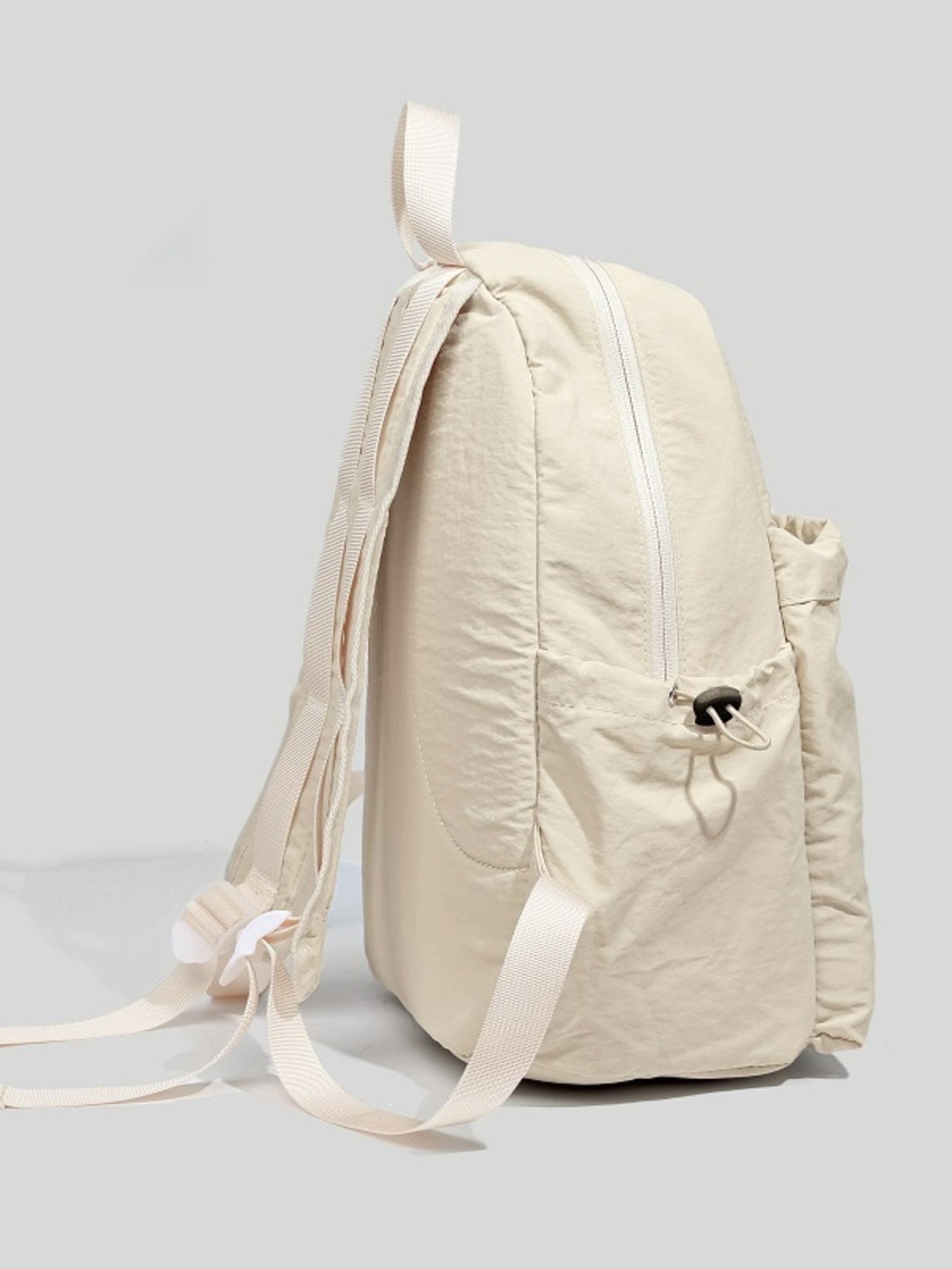 Beige backpack on a light gray background