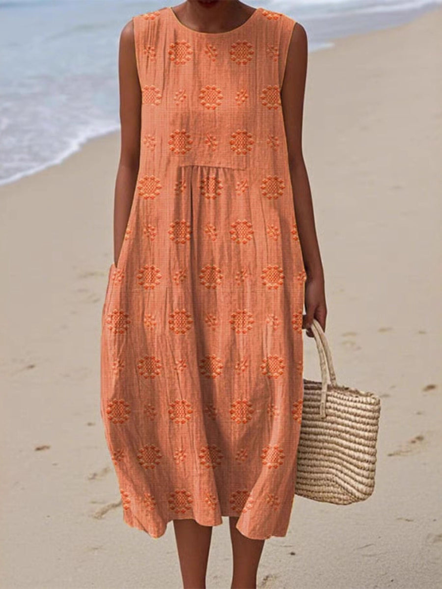 Person wearing an orange dress with a beach background