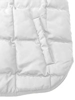Close-up of a white quilted jacket with a focus on texture and stitching.