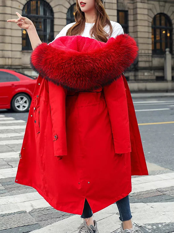  A lady holding a red Women's Detachable Longline Hooded Parka with Faux Fur Trim and Drawstring Waist