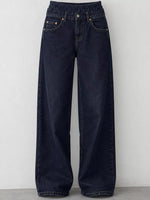 Dark navy blue wide-leg denim jeans with an elastic waistband, displayed against a plain light gray wall.