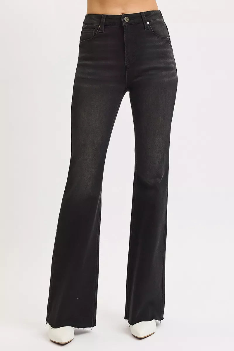 Black flared jeans on a white background