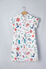 Children's dress with colorful patterns on a hanger against a gray background