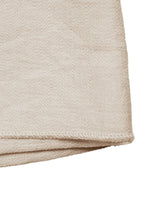 Beige fabric folded corner on a white background