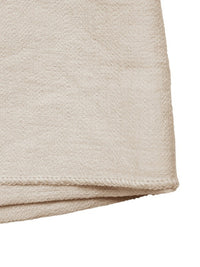 Beige fabric folded corner on a white background