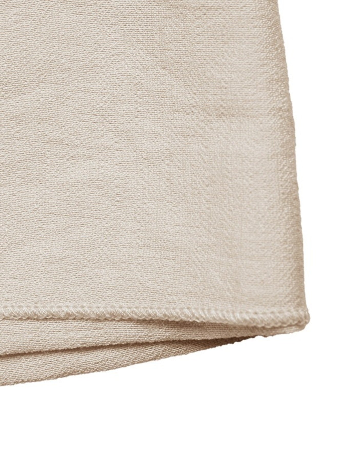 Beige fabric folded corner on a white background