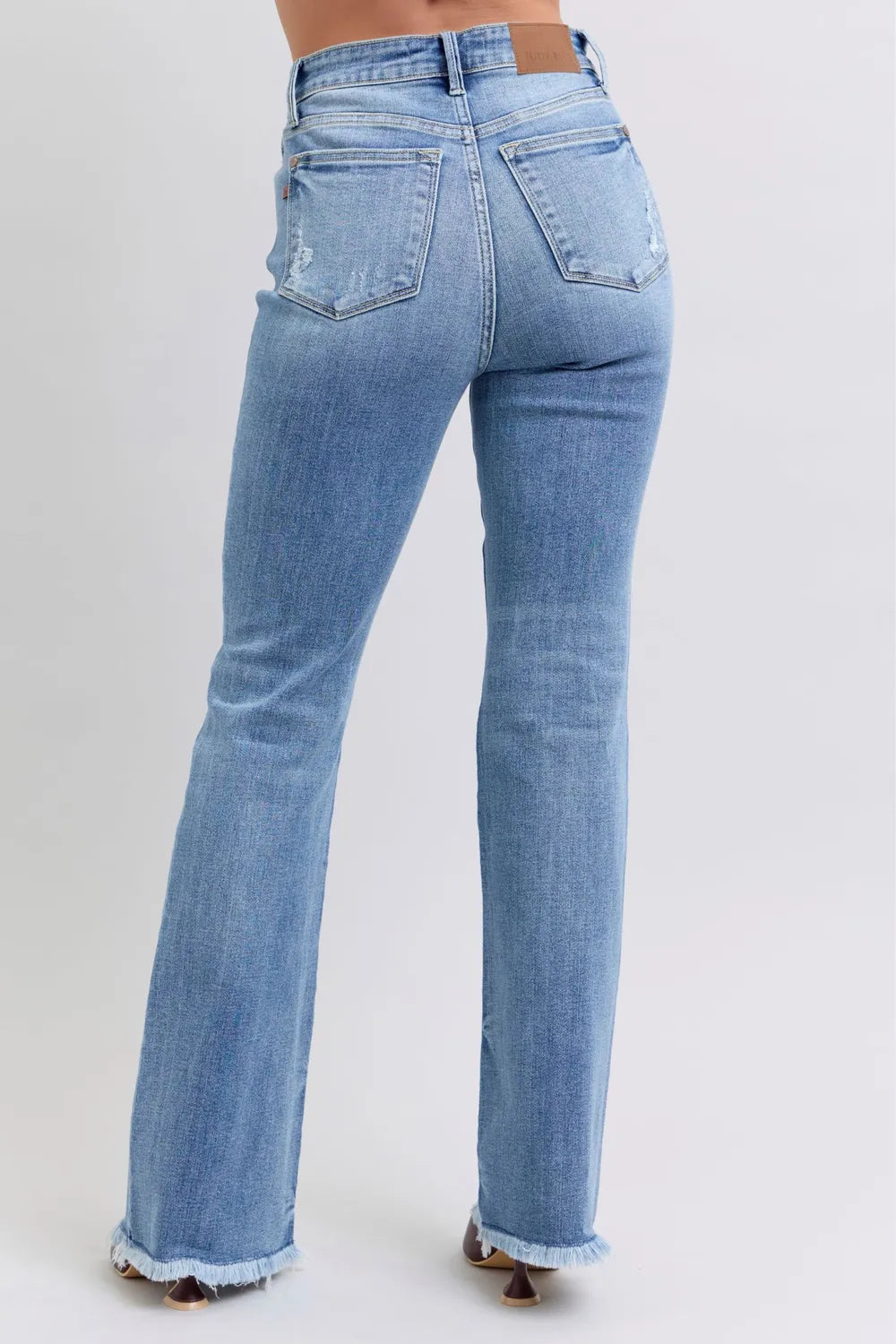 Light blue jeans on a plain background