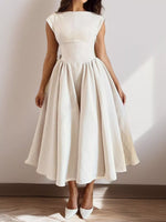 White dress with a plain background