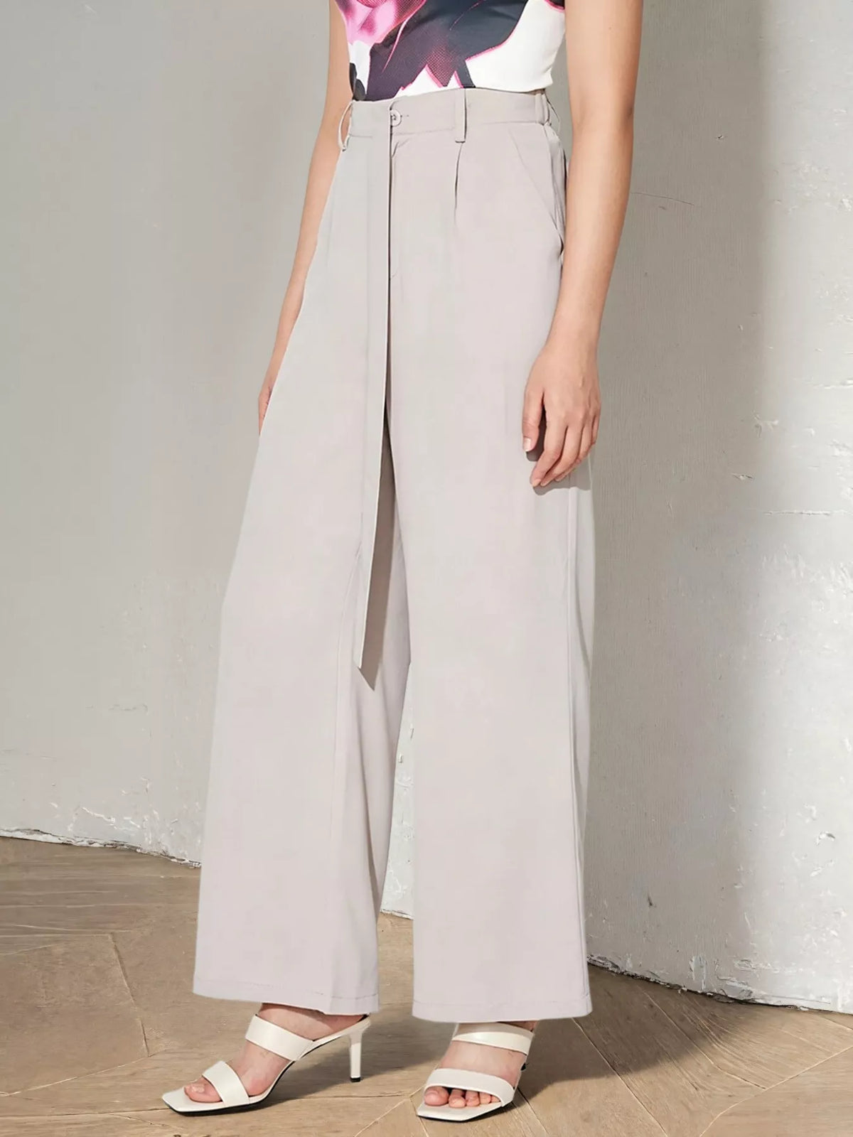 Light gray wide-leg pants worn by a person on a plain background