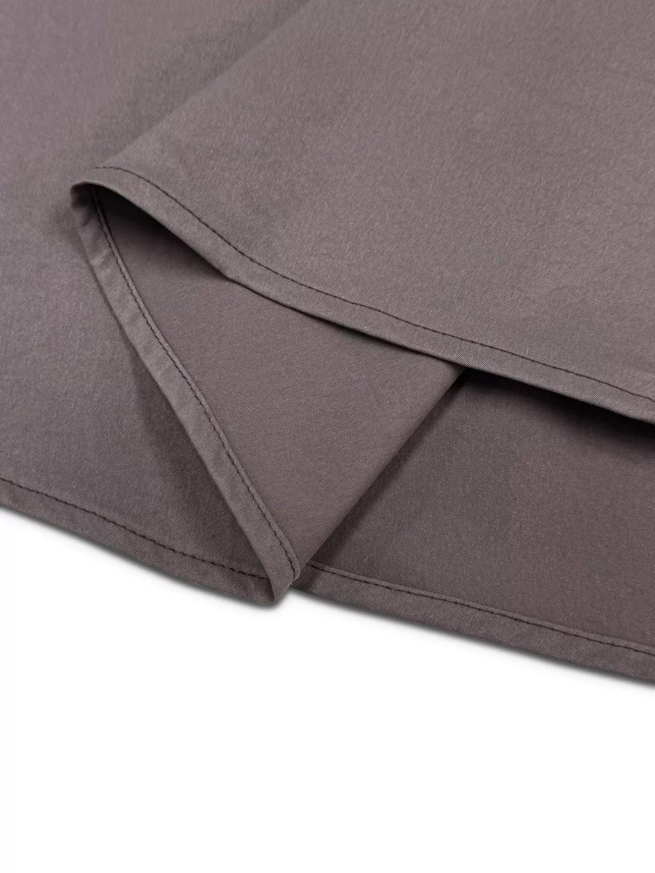 Close-up of gray fabric with a subtle texture on a white background