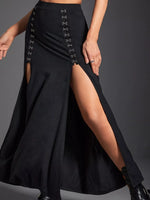 Black high-waisted skirt with front slit and button details on a gray background