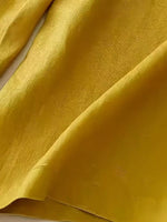 Close-up of textured yellow fabric