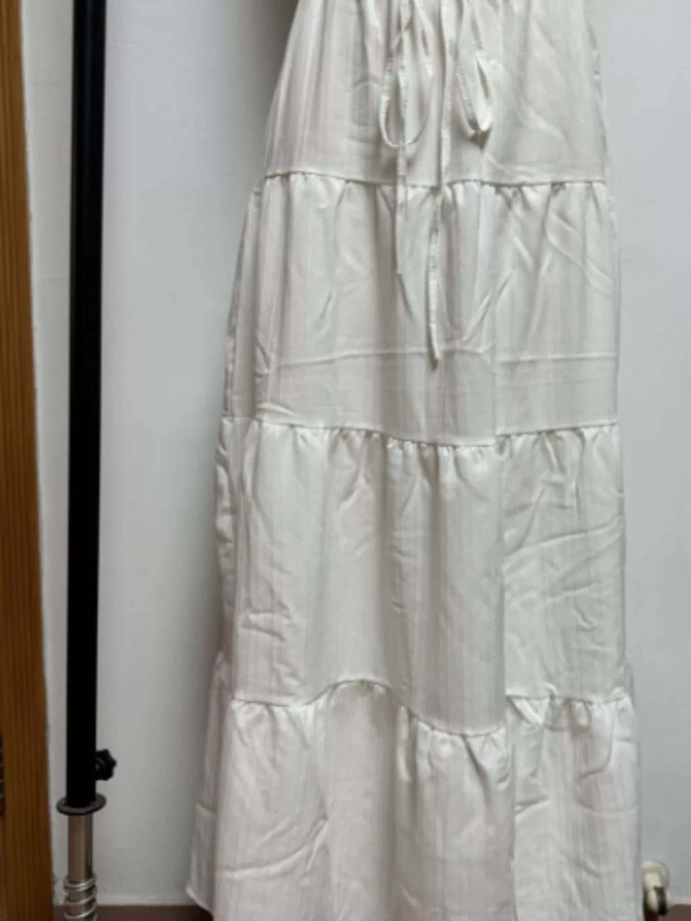 White tiered skirt against a plain background