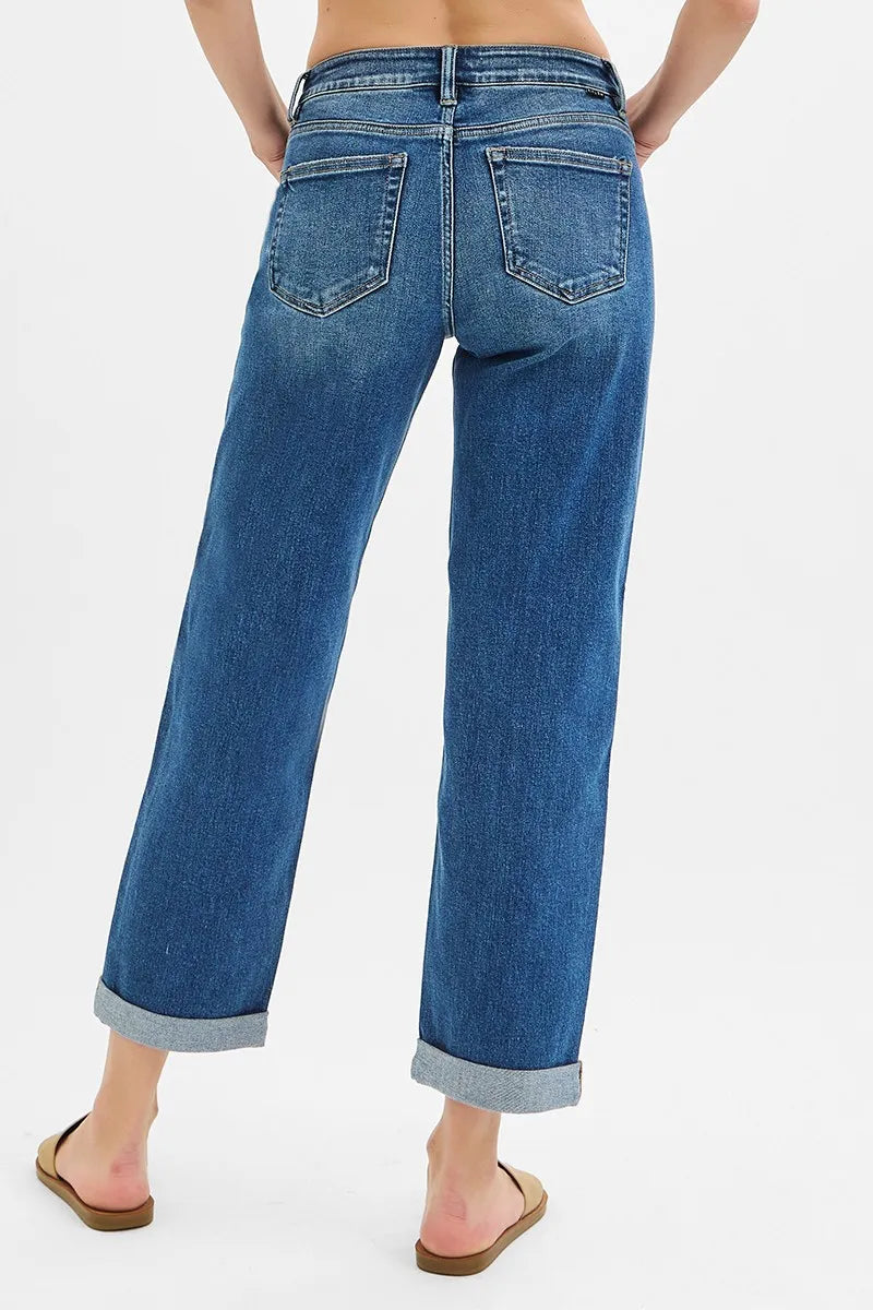 Blue jeans worn by a person on a white background