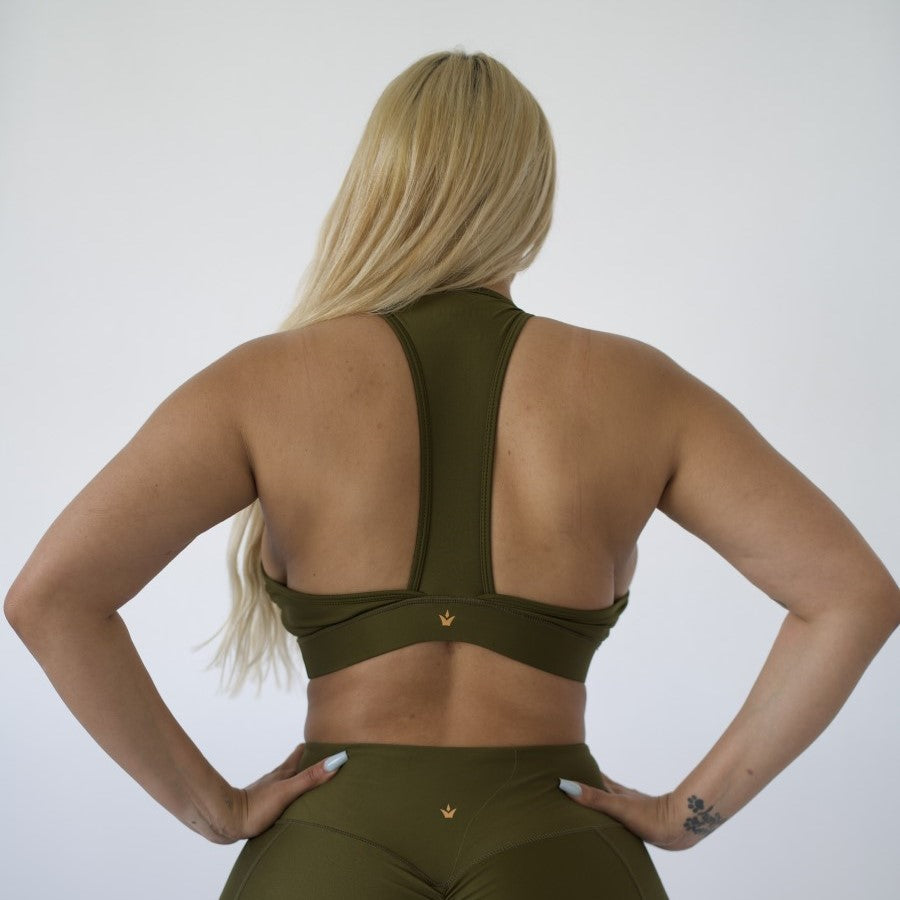 Lady showing the back of the Sports Bra | OLIVE 