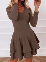 Brown dress worn by a person on a white background
