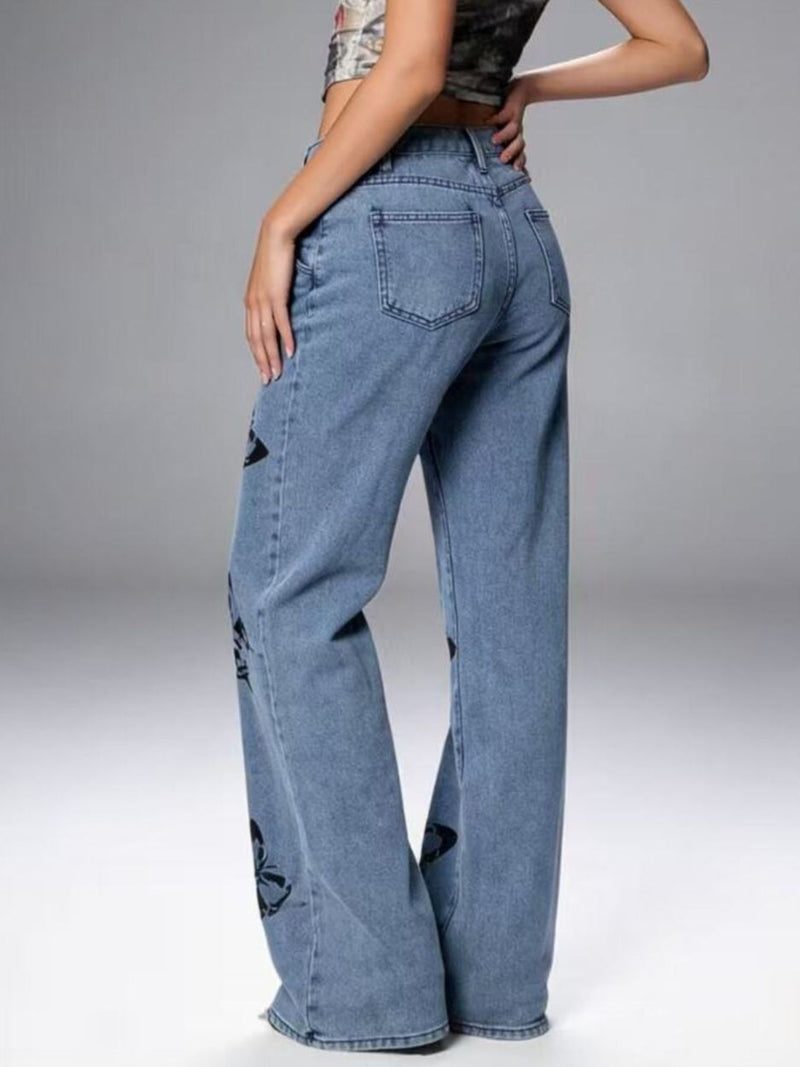 Person wearing blue jeans on a gray background