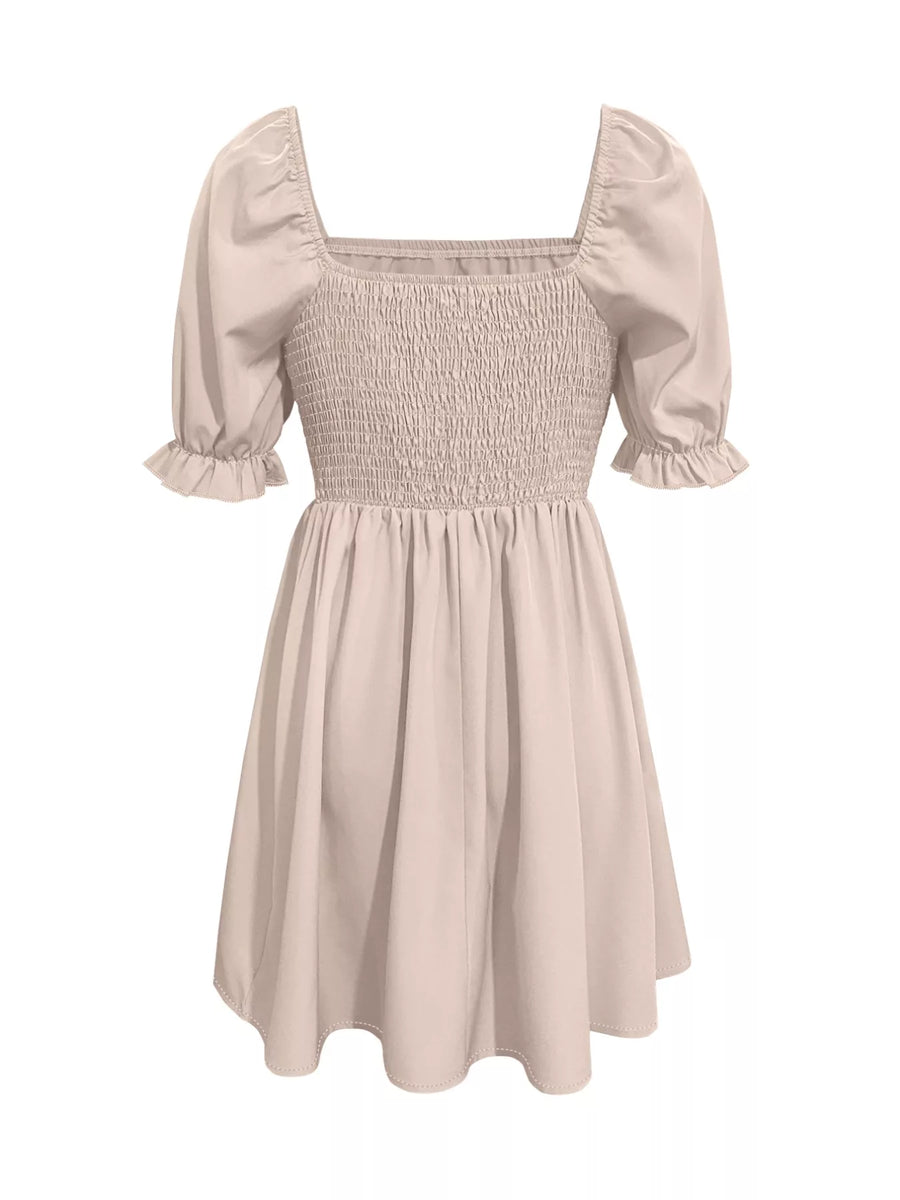 Beige smocked dress with puff sleeves on a white background