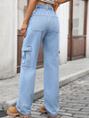 Person wearing light blue cargo jeans on a street.