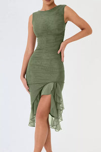 Green dress with a slit on a white background