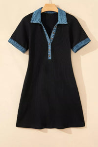 Black dress with denim collar on a beige background
