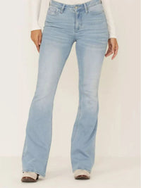 Light blue jeans worn by a person on a white background