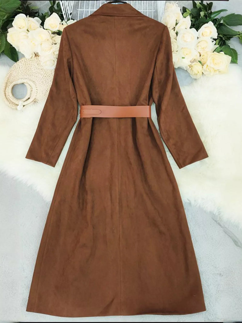Brown coat with a belt displayed against a white floral background