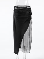 Black skirt with sheer overlay on a white background