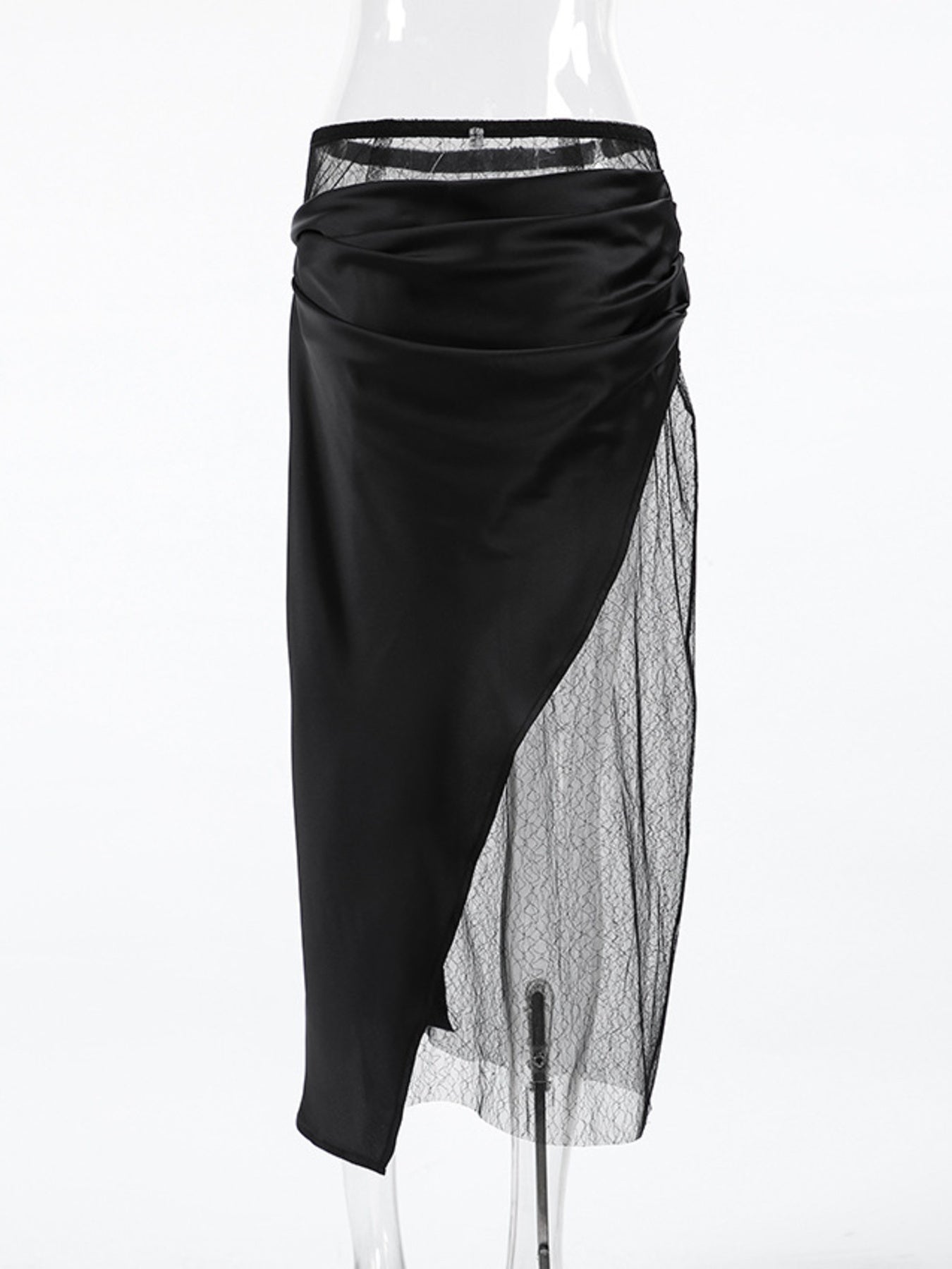 Black skirt with sheer overlay on a white background