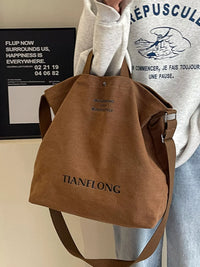 Brown backpack with 'TIANFLONG' branding worn by a person in a casual setting.