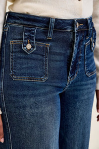 Close-up of blue jeans with a focus on the pocket area.