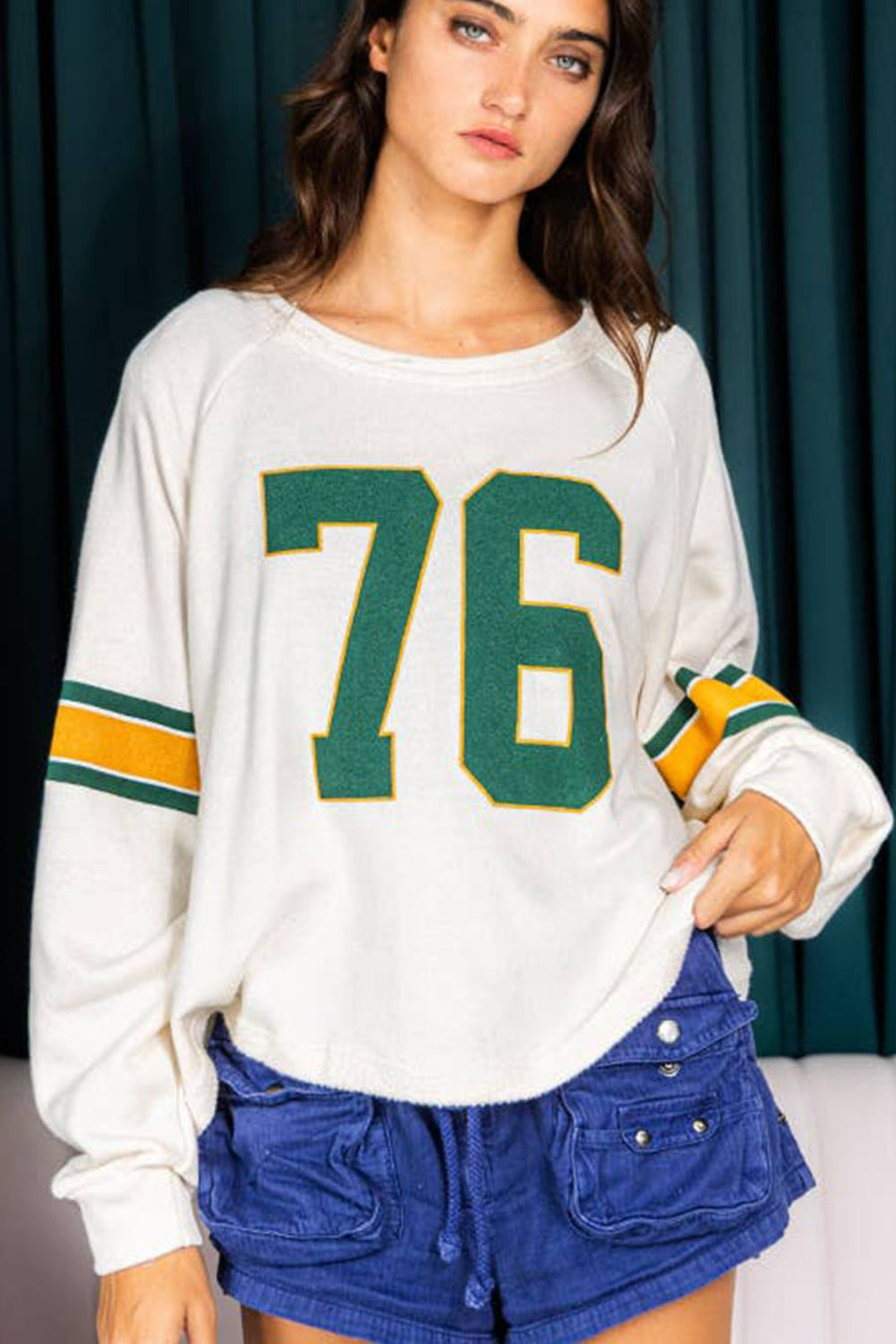 Close up view of Number 76 Round Neck Long Sleeve Top
