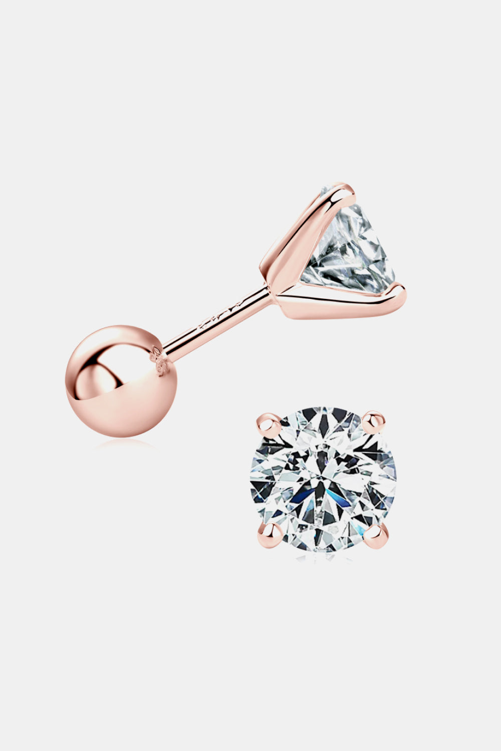 Rose gold stud earrings with clear gemstones on a light gray background