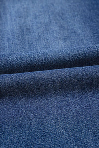 Close-up of blue denim fabric with a textured pattern