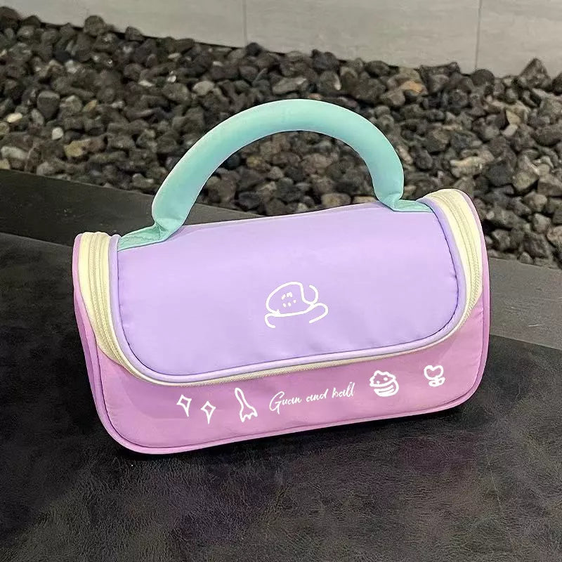 Pastel pink and purple bag with a handle on a dark surface