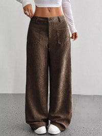 Brown wide-leg pants worn by a person on a plain background
