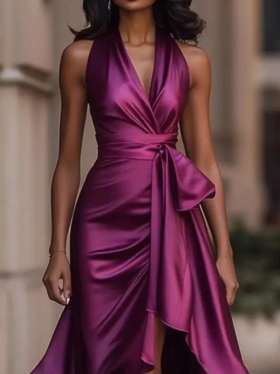 Woman wearing a purple satin dress with a blurred background