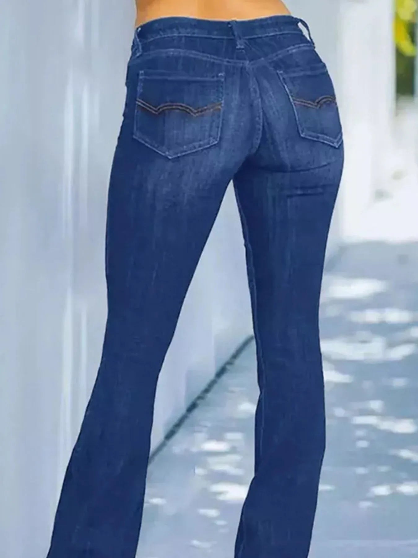 Blue jeans being worn with a blurred background