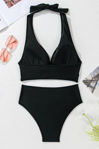 Black two-piece swimsuit with a bow detail on a white background