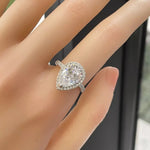 Diamond ring on a hand with a blurred background