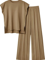 Beige sleeveless top and wide-leg pants on a white background