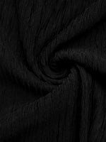 Close-up of black fabric with a textured pattern