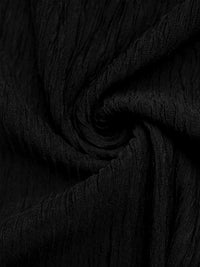 Close-up of black fabric with a textured pattern