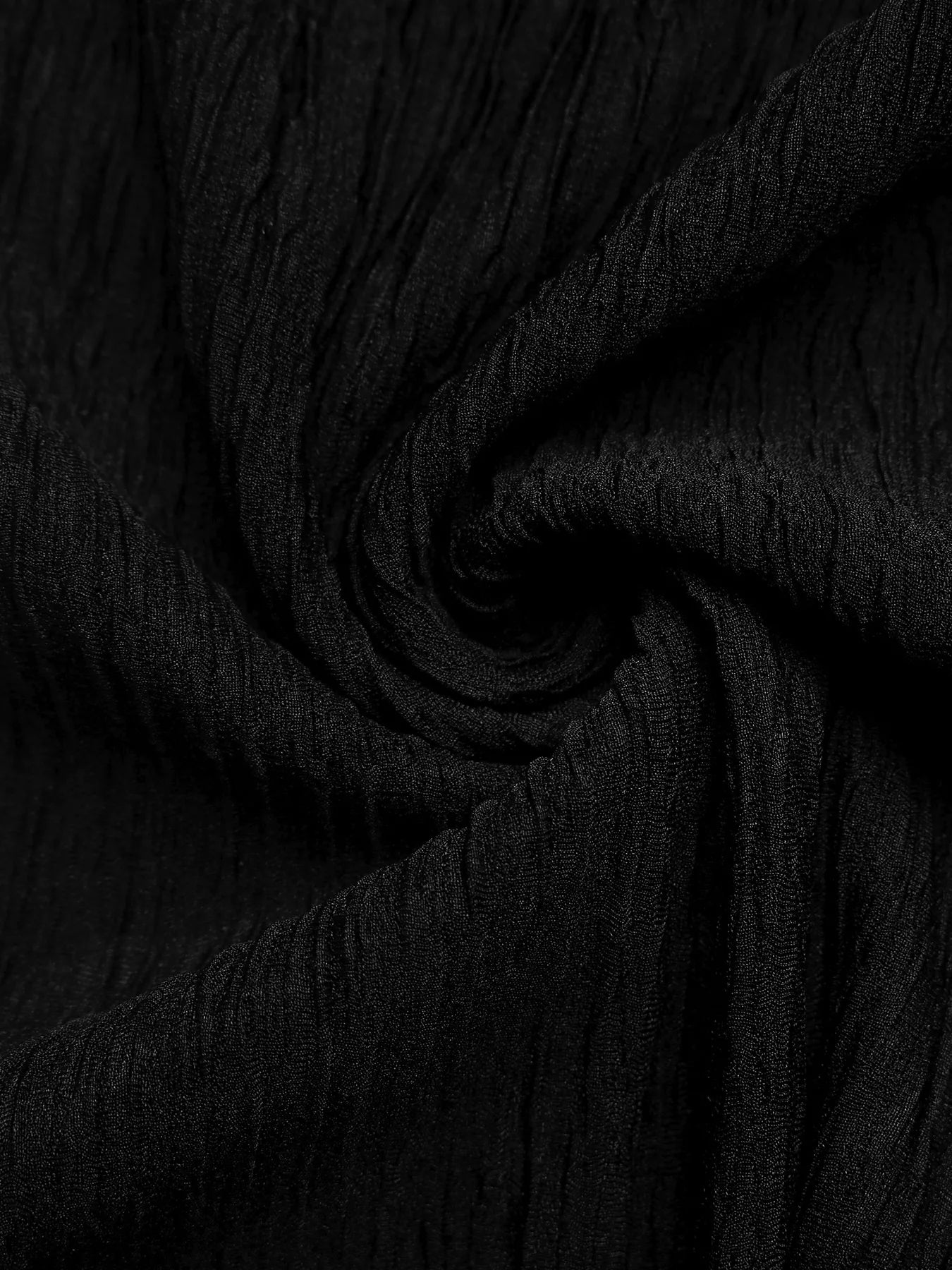 Close-up of black fabric with a textured pattern