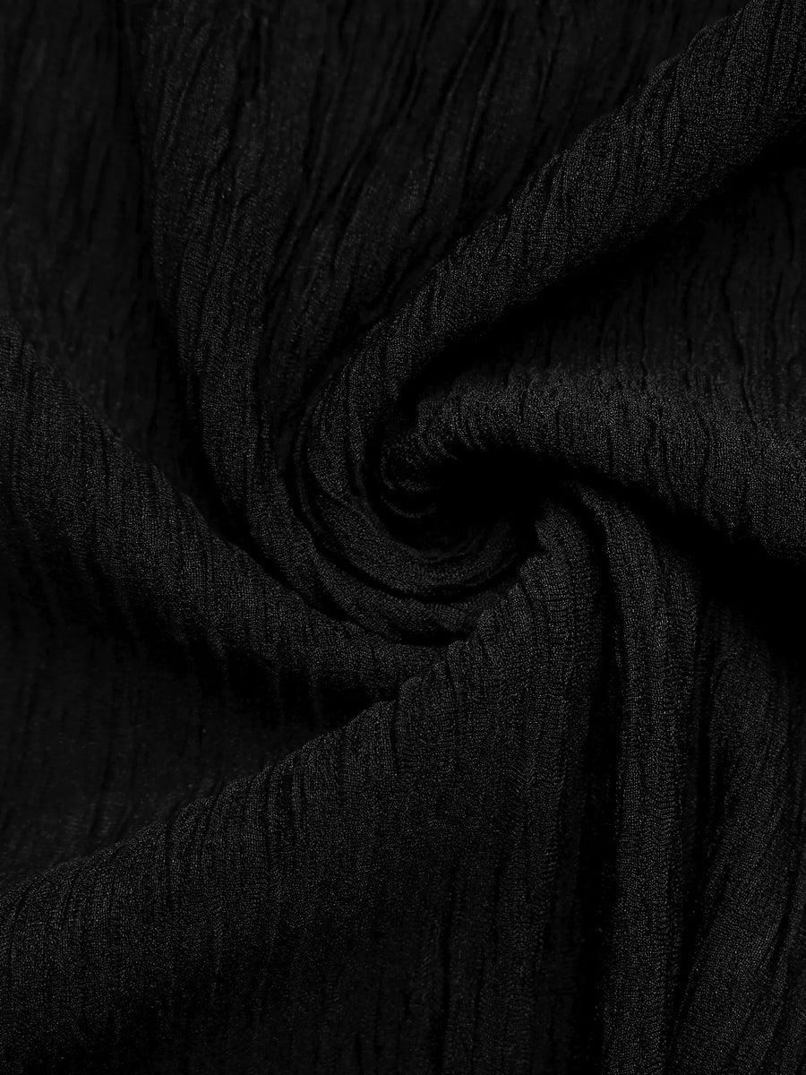 Close-up of black fabric with a textured pattern