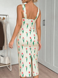 Woman wearing a dress with tulip pattern in a room.
