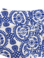 White fabric with blue floral patterns