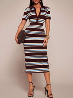 Woman wearing a brown and blue striped dress on a plain background